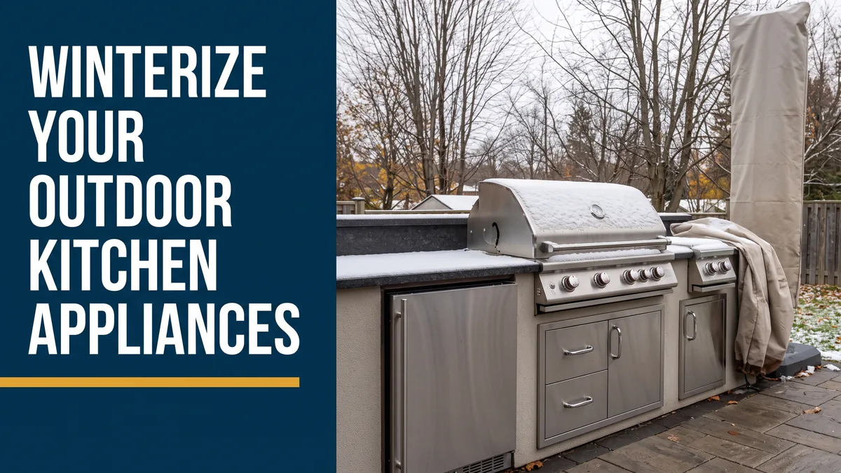 Snow-dusted patio grill and outdoor fridge, illustrating how to winterize outdoor kitchen appliances